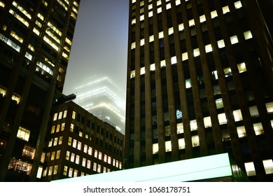 Dystopian Toronto skyscrapers in the fog on a rainy day, glowing and making a blade runner like slum look. Shining in the mist. - Powered by Shutterstock - Get 15% off with code: PIKWIZARD15
