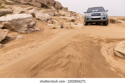 Dyubyanda. Azerbaijan. 03.17.2021.  Car On A Beautiful Beach By The Sea.