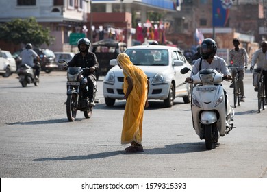 Dzajpur/India-November 19 2019 Year:An Old Woman Trying To Cross A Busy Street In The Center Of Dzajpur India