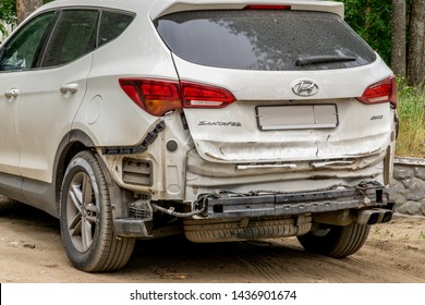 DZERZHINSK, RUSSIA - JUN 12, 2019: Dusty Damaged Hyundai Santa Fe After Car Accident. Vehicle With Removed Rear Bumper And Dented Back Hatch.