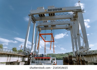 Dzerzhinsk, Russia, June 3, 2022. Loading of a chemical reactor in a port terminal using a gantry crane on a three-axis conveyor