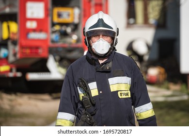 DZIESLAW, POLAND - APRIL 6, 20209 - Firefighters with face msk due to Covid-19 during the fire extinguishing action.