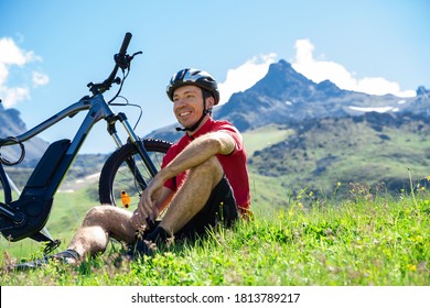 E Bike Bicycle In Austria. Man In Helmet With Mountain Ebike