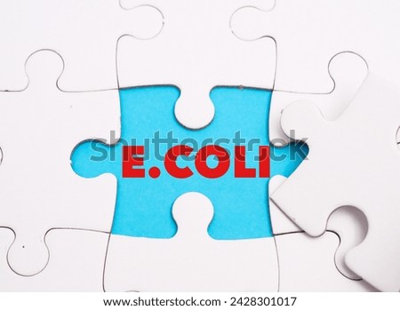 E. Coli word alphabet letters on puzzle as a background