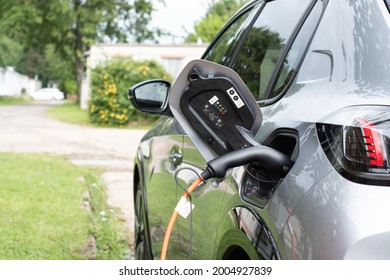 E Electric E-car On Charge Charging From Home In A Rural Setting