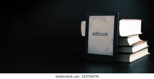 E reader. Digital e book, library reader tablet with books on dark background. Online education course, E learning class and ebook digital technology concept