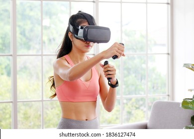 E Sport, Happy Asian Woman Wearing Virtual Reality Headset For Interactive Excercise At Home, Asia Girl Playing Vr While Workout Fitness, Female And Wearable Technology