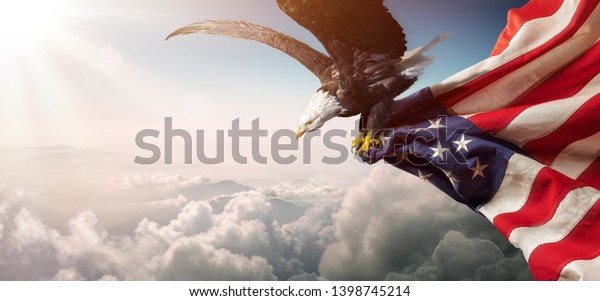 Eagle With American\
Flag Flies In Freedom\
