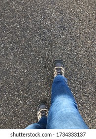 Eagle Eye View Of Hiking Shoe On Asphalt Road