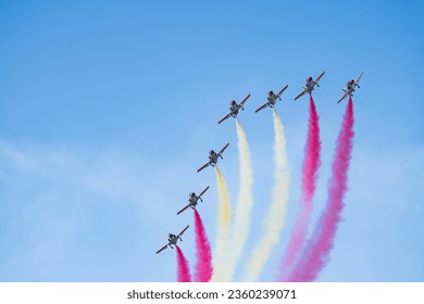 The Eagle Patrol aerobatic team of the Spanish Air Force drawing the Spain's flag in the air during the Armed Forces Day.