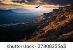 Eagle soaring above cliffs and valleys in dramatic outdoor wildlife environment