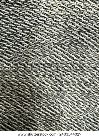 ean Background Black Denim Pattern. Classic Jeans Texture. Vertical Background Black Denim Pattern. Denim black jeans fabric. Canvas denim. Black jeans texture for any background.