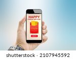 E-Ang Bao for happy chinese new year digital gift concept.Hands holding mobile phone