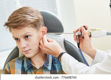 Ear, Nose, Throat Examining. ENT Doctor With A Child Patient And Endoscope