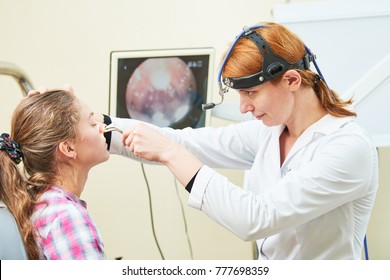 Ear, Nose, Throat Examining. ENT Doctor With A Child Patient And Endoscope