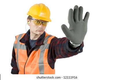 ear plugs goggles and protective gloves giving a stop sign with his hand. Clipping Path included - Shutterstock ID 12111916