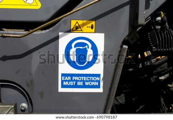 Ear\
Protection Sign On The Side Of Heavy\
Machinery