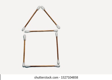 Ear sticks close-up on a light background laid out in the form of a house - Shutterstock ID 1527104858