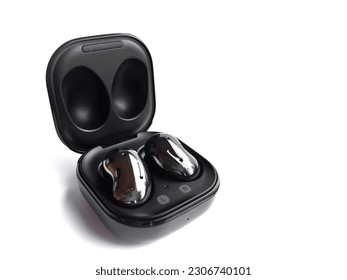 Earbuds. Black ear buds isolated. Wireless headphones with white background