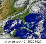 Earl Moves Up the East Coast. Once a tightly wound spiral of clouds with a clear eye, Hurricane Earl was a far more relaxed sprawling oval. Elements of this image furnished by NASA.