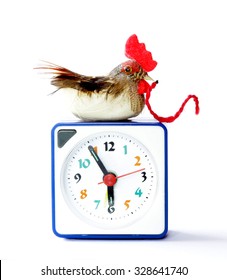 Early bird catches gets the worm proverb representing alarm clock on 6 am with bird and worm