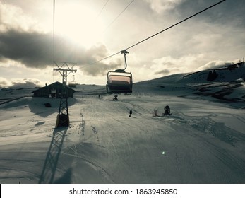 Early bird gets the worm ! Ski resort winter sports in the alps.