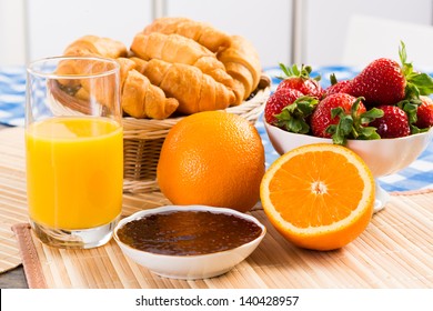 early breakfast, juice, croissants and jam, still life