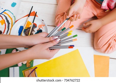 Early childhood education. Work tith mom together. Artistic child, unrecognizable art family top view, colorful drawing, creativity concept - Powered by Shutterstock