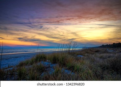 An early February sunset on Hilton Head Island, SC displaying dramatic clouds and colors.