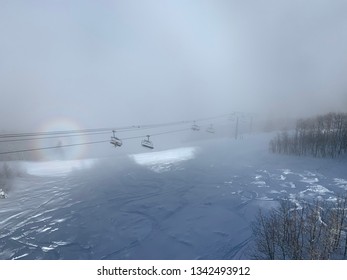 Early Foggy Morning On A Chairlift In Park City, Utah. Chairlift In Picture Is The Payday Lift. Photo Taken Aboard The Town Lift. Heavy Powder On Ski Slopes