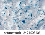 Early Melt on the Greenland Ice Sheet. In 2016, surface melt on the Greenland Ice Sheet started early and fast. Elements of this image furnished by NASA.