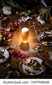 Early Morning After The Party. Glass Of Dark, Cold Lager, Beer On The Table With Confetti And Serpentine, Leftovers, Flower Petals. Food, Drink, Afterparty, Hangover, Celebration And Lifestyle Concept