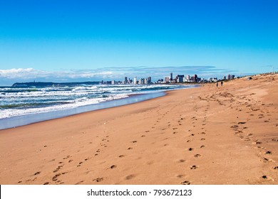 Early Morning Beach And Sea Against Blue Sky And City Skyline In Durban, South Africa