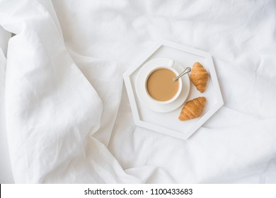 Early Morning Breakfast In Bed, Coffee And Croissant On The Tray