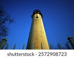 An early morning clear blue sky provides a fine backdrop for this "looking upward" view of the Fenwick Island Lighthouse. The Fenwick Light is located on the border between Delaware and Maryland.