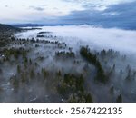 Early morning fog drifts through the scenic Willamette Valley in northern Oregon. This area is just south of the Pacific Northwest city of Portland.