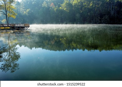 Early morning fog on Black Rock Lake, Georgia State Parks.  North Georgia Mountains. - Powered by Shutterstock