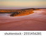 Early morning at the island of Lake Ballard and overlook at the salt lake. Touring, camping and exploring to outback of Western Australia at Lake Ballard near Menzies town.