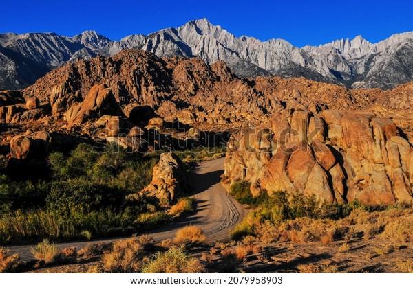Early morning light\
on Mount Langley, Lone Pine Peak, Mount Whitney and the rock\
formations of the Alabama Hills National Scenic Area, Lone Pine,\
Eastern Sierra, California,\
USA