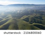 Early morning light shines on the rolling hills and valleys of the Tri-valley area of Northern California, just east of San Francisco Bay. This region is known for its vineyards and open space.
