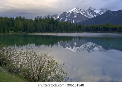 Early morning mountain reflection in Lake Herbert, Banff National Park, Canada