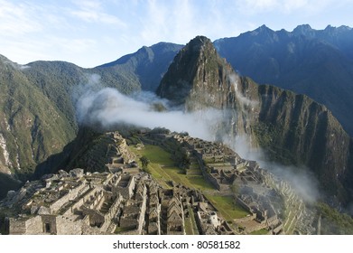 An Early Morning Photo Of The Mist Over Macchu Picchu