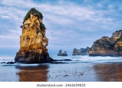 Early morning at Praia Dona Ana beach, with its spectacular sea stacks and cliffs in Lagos, Algarve, Portugal - Powered by Shutterstock