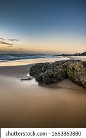 Early morning reflections gold coast beach rocky shore Currumbin sandy calm cloudy surf ocean coastal landscape