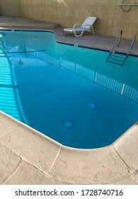 Early Morning Reflections Off Of Swimming Pool Water Before Sun Is Fully Overhead In Late Spring