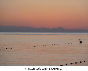 Early In The Morning. Sea.Quiet. Calm.Flags Hung Motionless. In The East The Sky Is 

Painted In Violet Color. 20 Minutes Later The Sun Comes Up.
