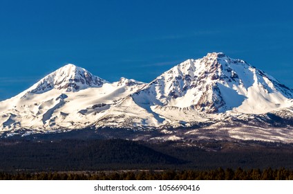 Early Morning Shot Of The North And Middle Sister Mountains In Central Oregon Near Bend.