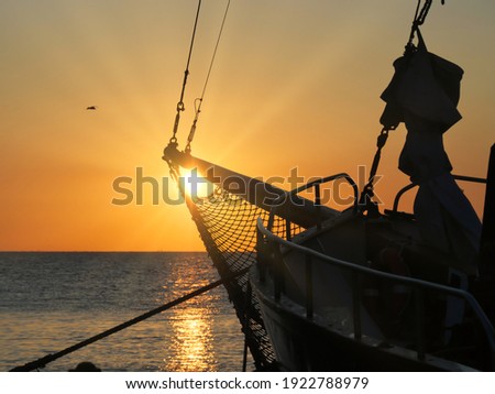 Early morning. Sun in the bow of the vessel. Nida, Lithuania.