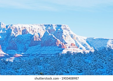 The Early Morning Sun Illuminates Wilson Mountain In Sedona, Arizona.