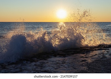 Early Morning Sunrise On The Beach, High Tide At Dawn. Waves Beat The 